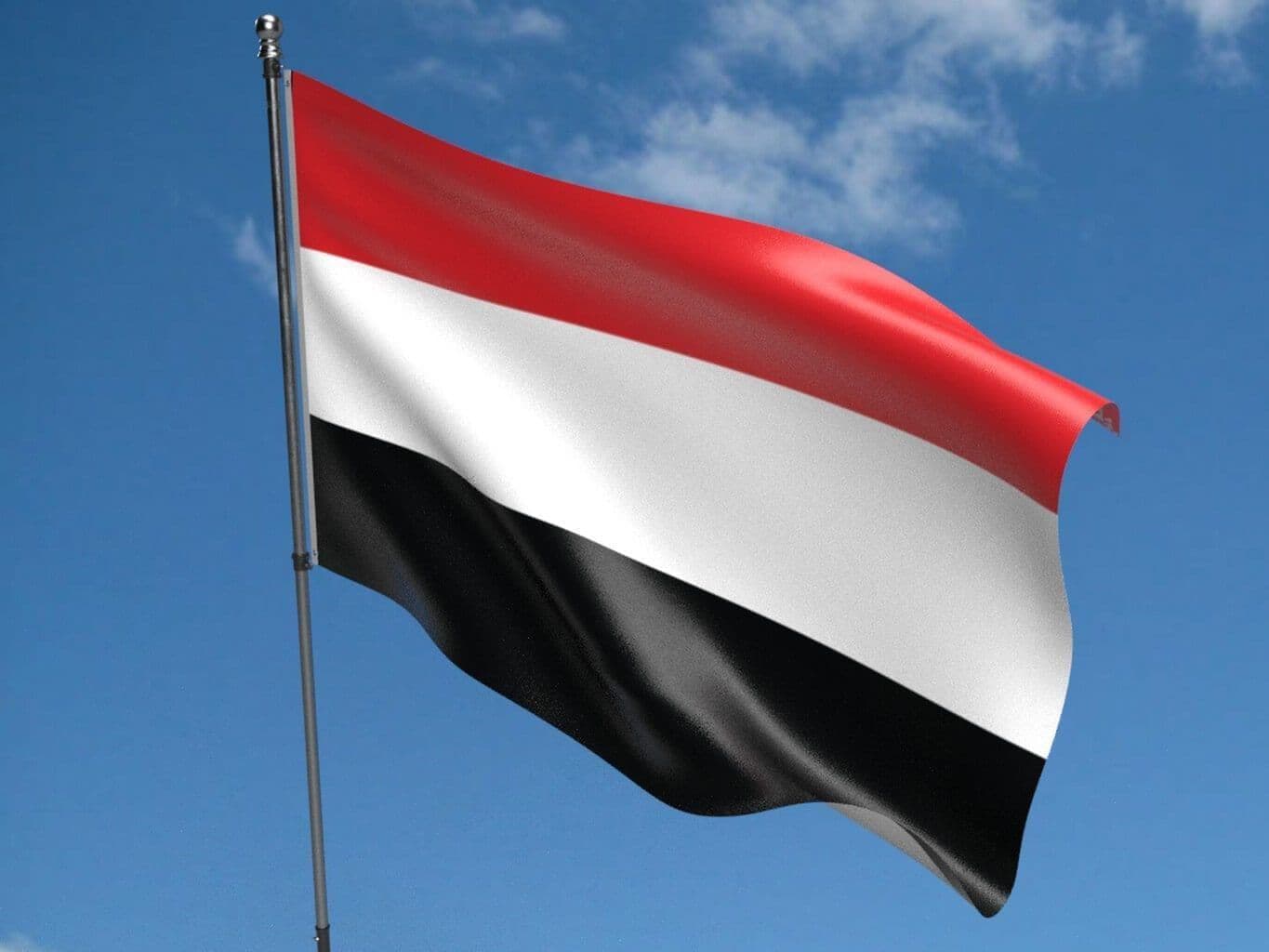 علم يمني محلق في السماء